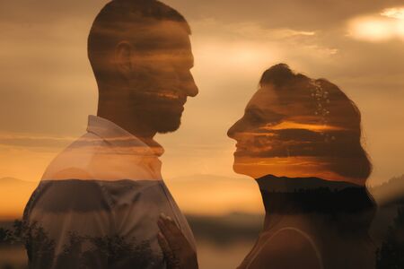 Multi-exposure of portrait of handsome man and beautiful woman. Close op of couple in mountainsの写真素材