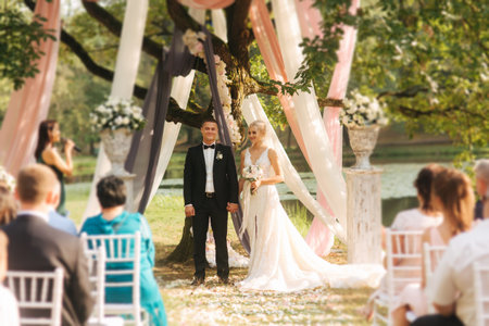 Wedding couple on ceremony outside. beautiful bride and handsome groom. Just married