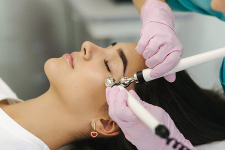 Close up of female face with soft skin. Woman at cosmetology clinic taking a beauty procedure for...