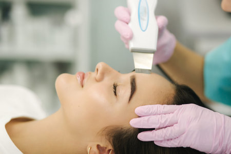 Close up of female face with soft skin. Woman at cosmetology clinic taking a beauty procedure for...