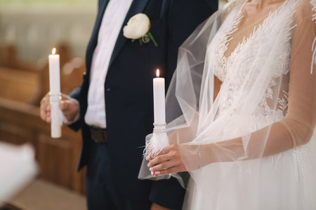 Close up hands of groom and bride in the church. wedding