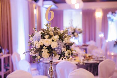 Wedding bouquet in restaurant on the table. Blue and white flowers. Rose and hydrangeaの写真素材
