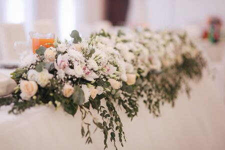 Floral decoration on the wedding table in restaurant.の写真素材