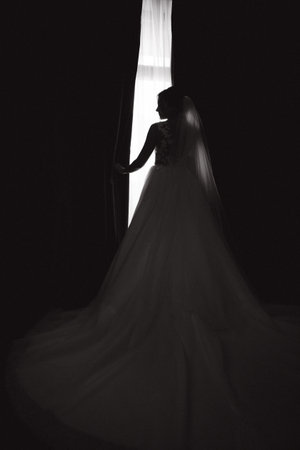Silhouette of bride in the morning at hotel