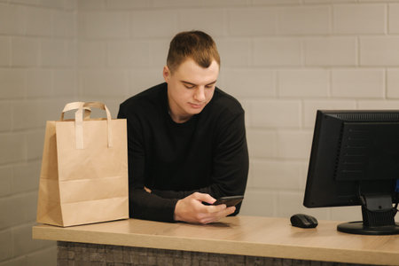 Happy customer with shopping bag in clothing room
