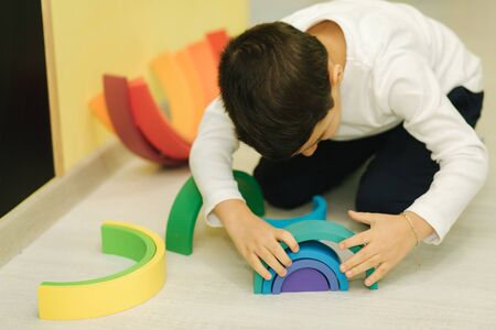 Boys play in different intelectual games in preschool classroom.の写真素材