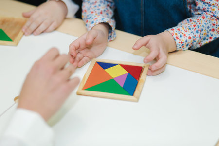 Close up of children play with different figures on the table