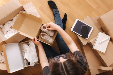 Tow view of young woman shop online using tablet and credit cardの写真素材