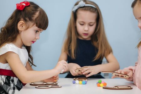 Smart kids learning in prescool class. Female chlidren play in kindergartenの写真素材