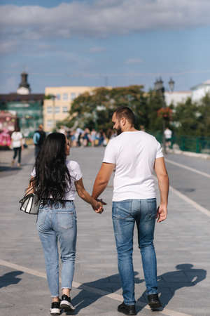 Man walking in the city with his lovely girlfriend. Happy coupleの写真素材