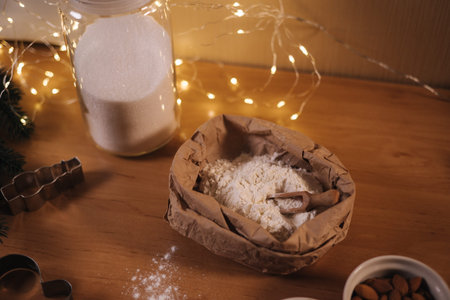 Home made sweets concept. Christmas bakery of gingerbread. Flour and sugar on the wooden table