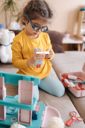 Happy adorable girl playing doctor. Cute little girlの写真素材