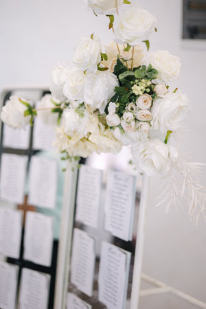 Wedding bouquet in restaurant on the table. White flowers .Element of decor in restaurant. Decoration on wedding. Beautiful and elegantの写真素材