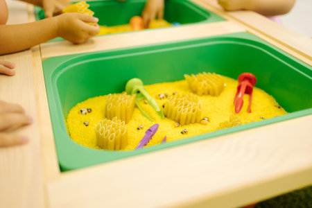 Children with kinetic sand. Hand of little kidの写真素材
