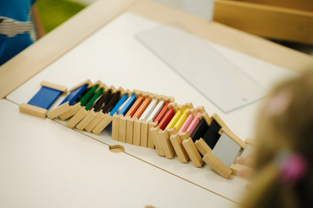 Children in kindergarten put together educational puzzlesの写真素材