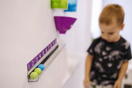 Children learn to count using colorful balls. Kindergarden. Education for kidsの写真素材