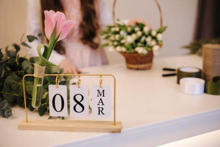 Eight march on calendar in flower shop. Preparing for holiday. Womans day