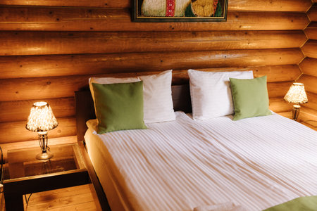Hotel room in a wooden house. Authentic and stylish interiorの写真素材