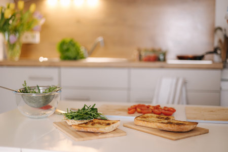 Table with bruschetta in the kitchen. Preparing vegan sandwich. Home made food concept. No peopleの写真素材