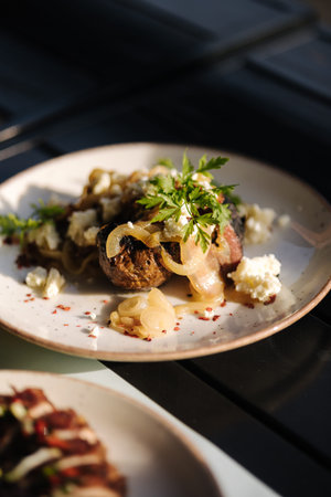 Delicious baked potatoes in a uniform with onions and lardの写真素材