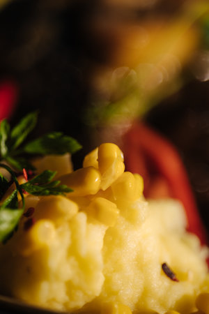 Close-up of corn on mashed potatoes. Delicious vegan foodの写真素材