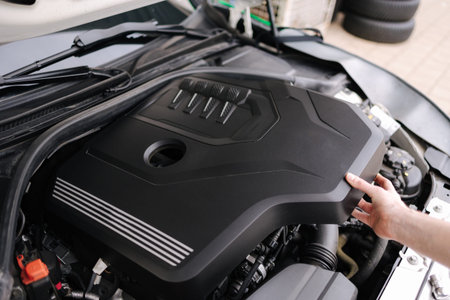 First person view of Auto mechanic working in garage. Repair service concept