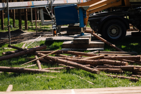 Process of building rustic house in the park. Lot of log trunksの写真素材