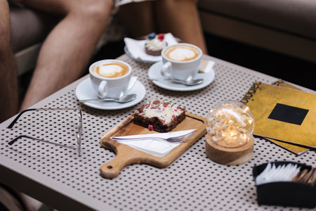 Table with with two mug of cappuccino. Cafe terraceの写真素材