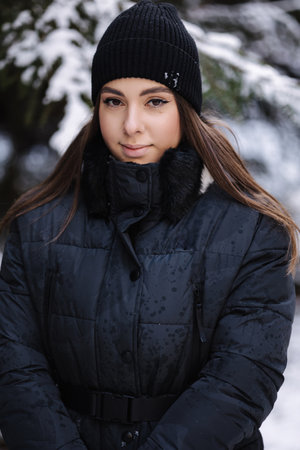 Portrait of attractive young woman in winter forest. Christas moodの写真素材