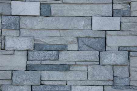 Facing of a facade of a building under a natural stone