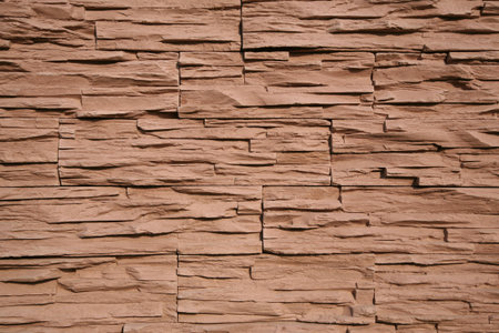 Facing of a facade of a building under a natural stone