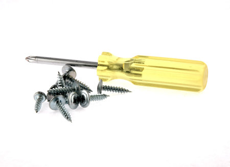 Screw-driver and screws on a white background