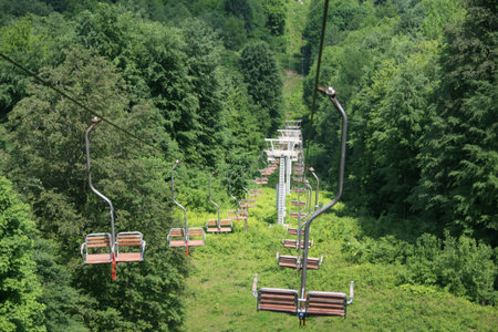 The rope-way rises on mountain topの写真素材