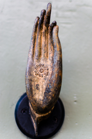 A model bronzed hand resembling a hand of Buddha の写真素材
