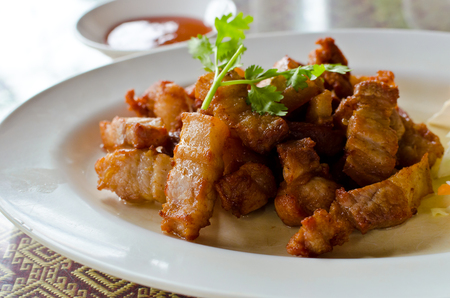 Fried pork belly with fish sauce, a Thai cuisine.の写真素材