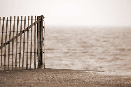 Cape Cod Massachussets Wooden Fence on Beachの写真素材