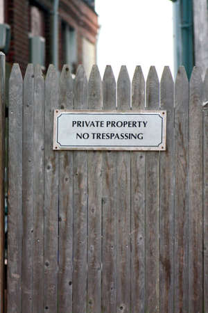 Private Property No Trepassing Sign on Wooden Fenceの写真素材