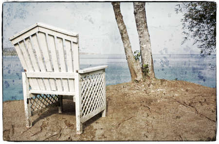 View on the Ocean on a Vintage Wooden Chairの写真素材