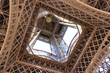 Underneath view of the Eiffel Tower structureの写真素材