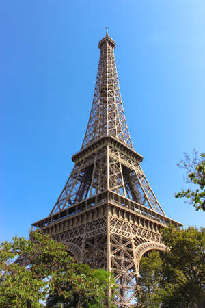 View of the Eiffel Tower with trees surroundingの写真素材