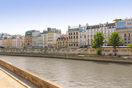 View of a traditional residential building with typical balconies in Parisの写真素材