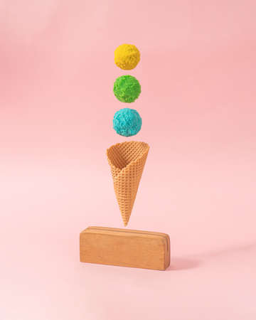 Minimal summer infographic design of colorful ice cream against pastel pink background with creative copy space. Deconstructed food styling concept.の写真素材