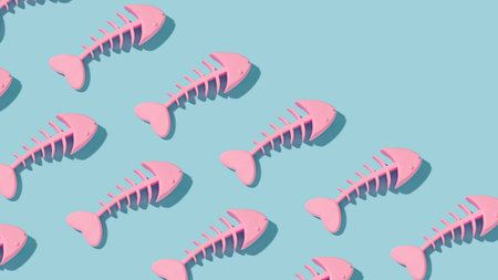 Trendy composition pattern with pink fish skeleton on sunny blue background. Diagonal copy space.の写真素材