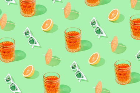 Colorful tropical pattern with summer party props on bright green background. Beach party wallpaper.の写真素材