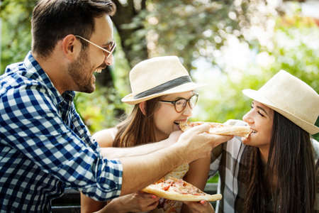 Group of young people having fun in the park.の写真素材