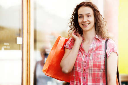 Young woman is relaxing after shopping.の写真素材