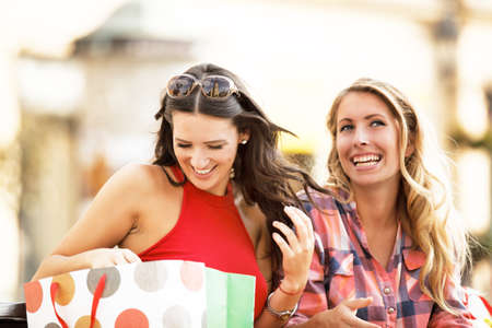 Beautiful girls in shopping.の写真素材
