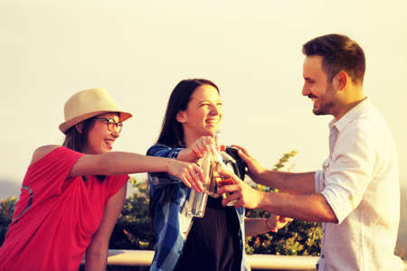 Group of young people having fun in the park.の写真素材
