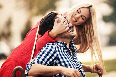 Young happy couple is enjoying city.