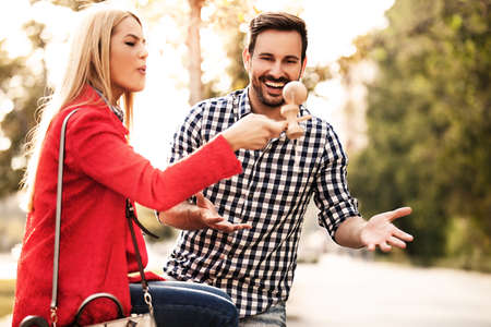 Young happy couple is playing by kendama.の写真素材